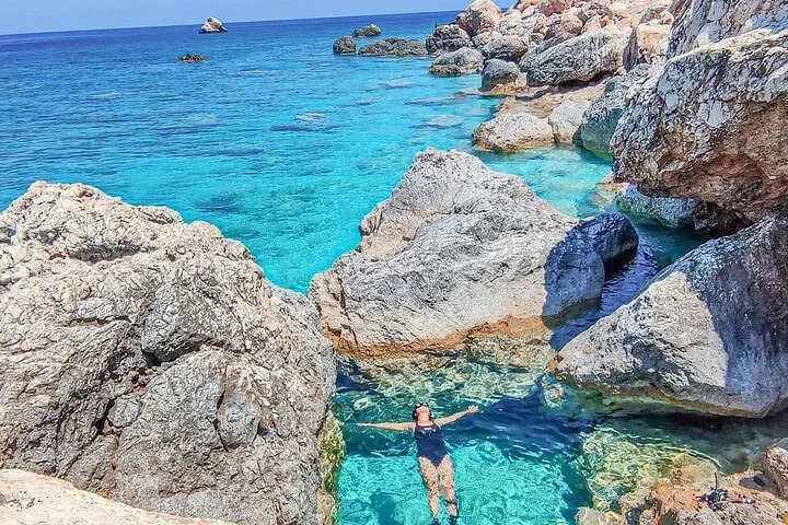 Swimmers enjoying the aquarium-like waters of Suluada